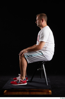  Louis  2 dressed grey shorts red sneakers sitting sports white t shirt whole body 0001.jpg